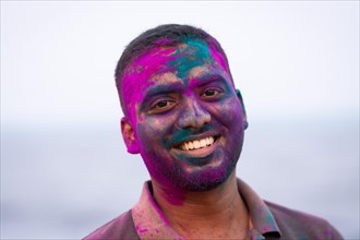 Man with colour on his face, Holi Festival, Indian spring festival, traditional festival of