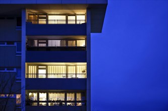 Illuminated flats in a tower block in Gropiusstadt. The rise in rents in German cities has