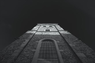 Top view of a church tower in black and white with dramatic sky, Wuppertal Elberfeld, North