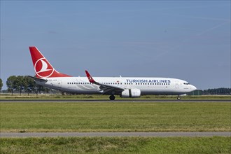 Turkish Airlines with registration Boeing 737-8F2 TC-JVS lands on the Polderbaan, Amsterdam