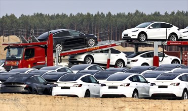 Tesla Y models produced in the Tesla Giga Factory are loaded onto car transporters, Gruenheide, 12