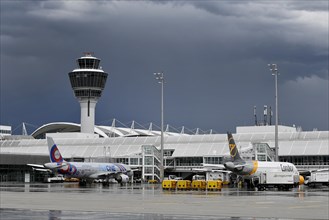 Condor and FLYONE at check-in position at Terminal 1 with storm and rain cloud, Munich Airport,