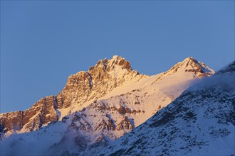 Alpenglow over the mountain Gran Serra at sunset, Gran Paradiso National Park in the Valle d'Aosta,
