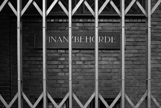 Sign with inscription Finanzbehoerde, behind bars, Hanseatic City of Hamburg, Hamburg, Germany,