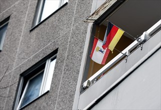 A tenant in the Gropiushaus has decorated his balcony with a German flag and the flag of Berlin.