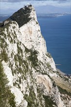 Sheer white rock mountainside the Rock of Gibraltar, British territory in southern Europe