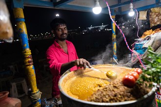 Vendor at food stall, Marina Beach, Chennai, Tamil Nadu, India, Asia
