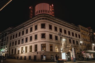 Historic bank building at night with warm street lighting in an urban environment, Pforzheim,