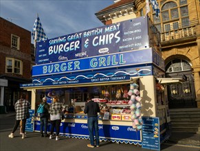Mops fair fairground, High Street, Marlbrough, Wiltshire, England, UK October 7th 2023, Burger and