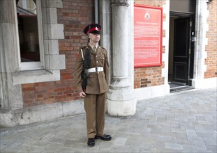Soldier on duty outside the Convent building official residence of the Governor, Gibraltar, British