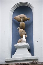 Bird sculpture of pigeons and seagull, Arwenack Street, Falmouth, Cornwall, England, UK