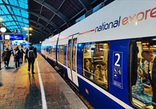 National Express local train on the platform early in the morning at Cologne Central Station,