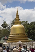 People at Dambulla Buddhist complex golden stupa, Sri Lanka, Asia