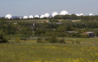 White circular radomes of satellite ground station, RAF Menwith Hill, North Yorkshire, England, UK