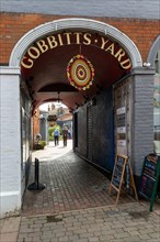 Entrance to Gobbitt's Yard shopping area, High Street, The Thoroughfare, Woodbridge, Suffolk,