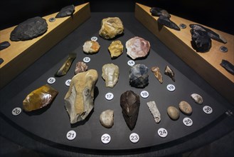 Prehistoric artefacts like flint tools on display in the Cinquantenaire Museum in Brussels,