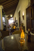 Evening drinks colonial style veranda bar of Galle Fort Hotel, historic town of Galle, Sri Lanka,