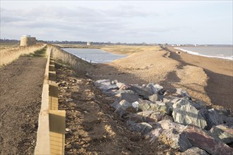 New rock armour coastal defences shingle beach at East Lane, Bawdsey, Suffolk, England, UK