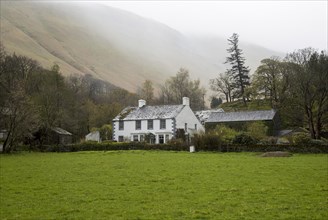 Traditional stone farmhouse at Howtown, Ullswater, Cumbria, England, UK