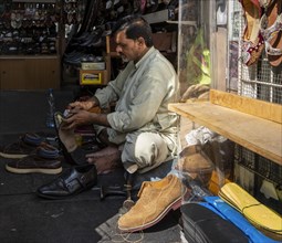Shoe shops and craftsmen in the Al Fahidi neighbourhood, Dubai, United Arab Emirates, Asia