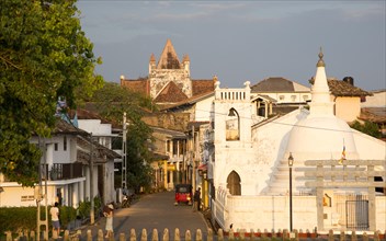 Street and house in historic town of Galle, Sri Lanka, Asia with Christian church and Buddhist