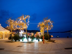 Blue hour, Christmas decoration at the harbour, harbour of Mali Losinj, island of Losinj, Kvarner