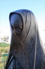Statue close up of traditional clothes worn by women in Vejer de la Frontera, Cadiz province,
