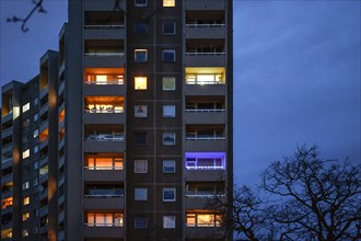 Illuminated flats in a tower block in Gropiusstadt. The rise in rents in German cities has