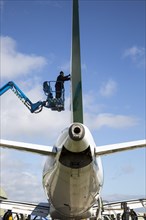 Man repairing plane Cotswold Airport, Cirencester, Gloucestershire, England, UK