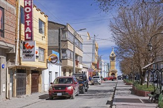 Main street and yellow clock tower in the city Uyuni, Antonio Quijarro Province, Potosi Department,