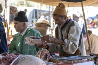 Man cutting up meat, weekly market market, Ourika, Morocco, Africa