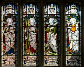 Stained glass window of four saints c 1906, church of Saint Nicholas, Biddestone, Wiltshire,