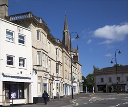 Market place buildings and St Andrew's church spire, Chippenham, Wiltshire, England, UK