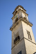Cathedral church bell tower belfry in Jerez de la Frontera, Cadiz province, Spain against blue sky