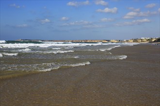 Waves breaking on sandy beach at Conil de la Frontera, Cadiz Province, Spain, Europe
