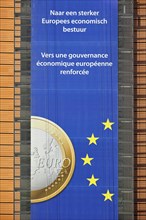 Banner about the euro hanging from the Berlaymont building of the European Commission, executive