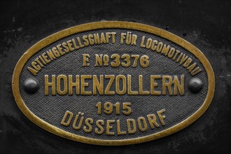 Brass factory plate of the 'Actiengesellschaft fuer Locomotivbau Hohenzollern' from 1915,