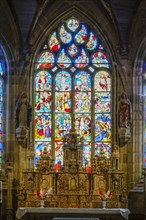 High altar and stained glass windows in the choir of Saint Germain church, Enclos Paroissial de