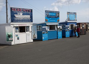 Boat trip ticket sales booths to the Farne Islands at Seahouses, Northumberland, England, UK