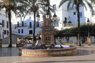 Fountain and palm trees in Plaza de Espana, Vejer de la Frontera, Cadiz Province, Spain, Europe
