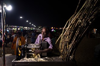 Sugarcane vendor, Marina Beach, Chennai, Tamil Nadu, India, Asia