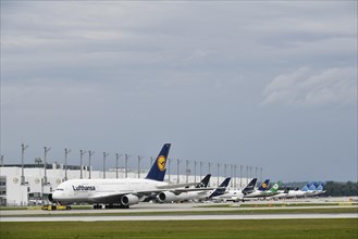 Lufthansa Airbus A380-800 in tow with push back truck in front of Terminal 2, Munich Airport, Upper