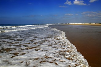 Wave breaking on sandy beach at Conil de la Frontera, Cadiz Province, Spain, Europe