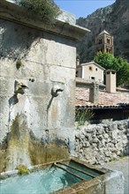 Old fountain at Moustiers-Sainte-Marie, Provence, Provence-Alpes-Cote d'Azur,