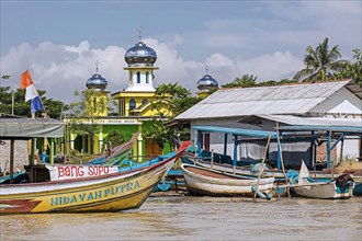 Boats and mosque in little Indonesian village between Pangandaran and Cilacap, West Java,