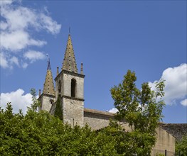 Church tower of L'Abbatiale de Goudargues in Goudargues, Departement Gard, Occitanie region,