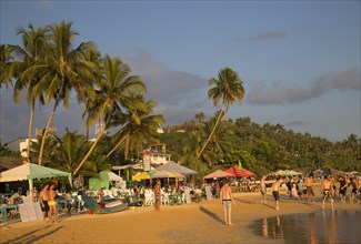 Crowded sandy beach at Mirissa, Sri Lanka, Asia