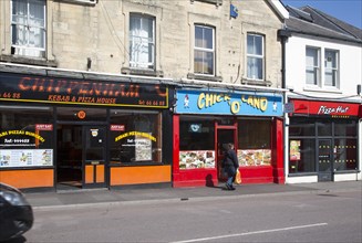 Row of fast food take-away restaurant shops, Chippenham, Wiltshire, England, UK
