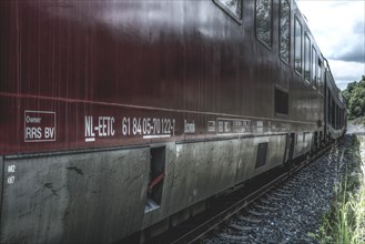 Close-up of a red train carriage with focus on the side lettering, Dornap-Hahnenfurth railway