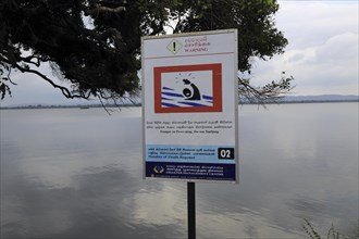 Warning sign not to swim in the lake, Polonnaruwa, North Central Province, Sri Lanka, Asia